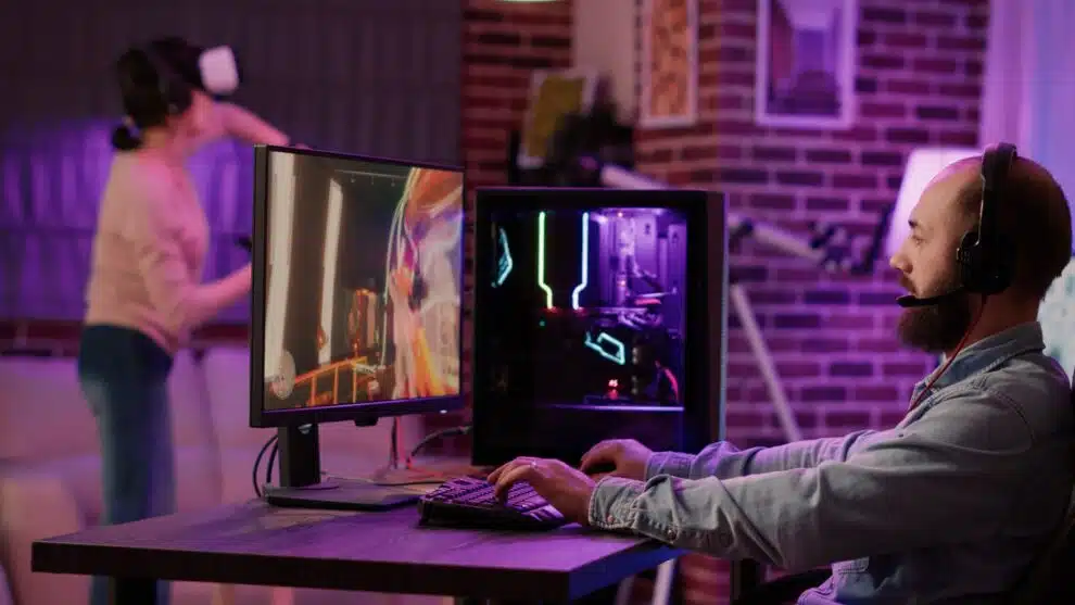 Jak wybrać idealny sprzęt gamingowy? Poradnik wyboru najlepszego sprzętu dla wymagających graczy 3 Man Streaming Multiplayer Online First Person Shooter On Pc While Gaming Girl Is Fighting In Virtual Reality Game