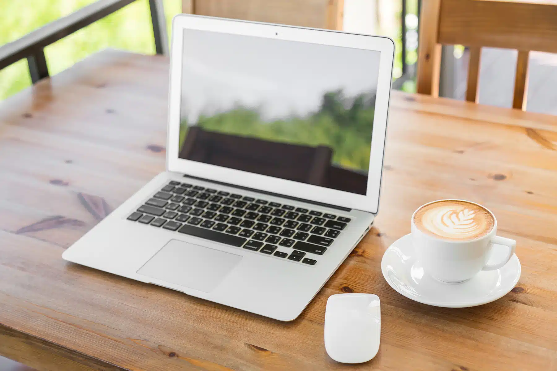 Laptop With Coffee Cup On Old Wooden Table